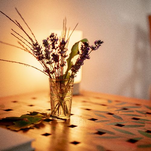 A vase with flowers on display
