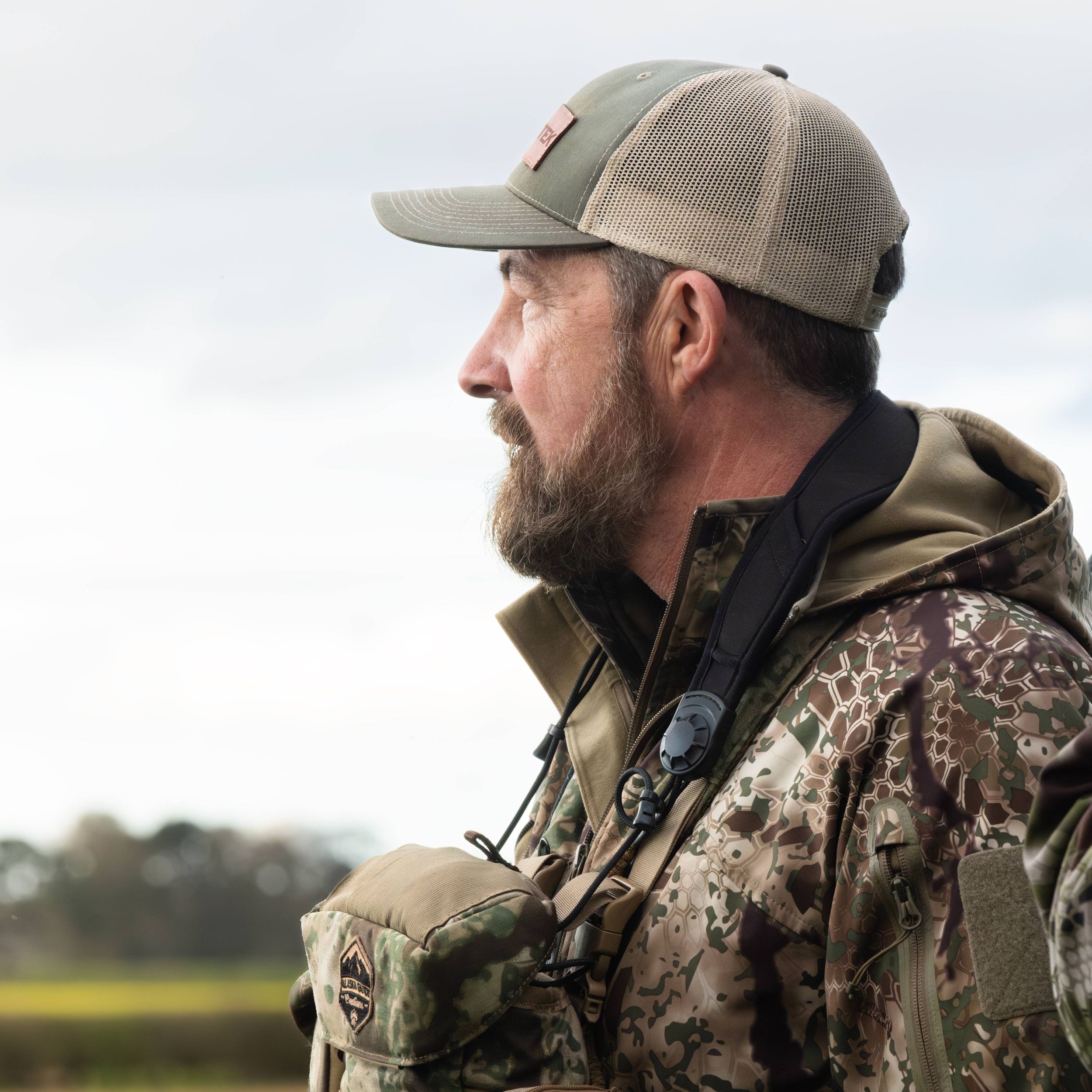 Side profile shot of a man in hunting camo