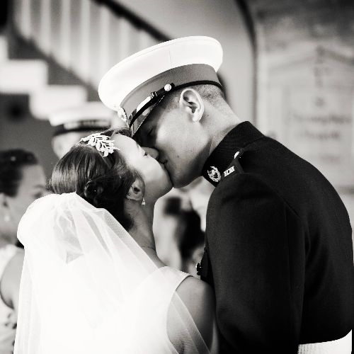 A couple kissing at a wedding
