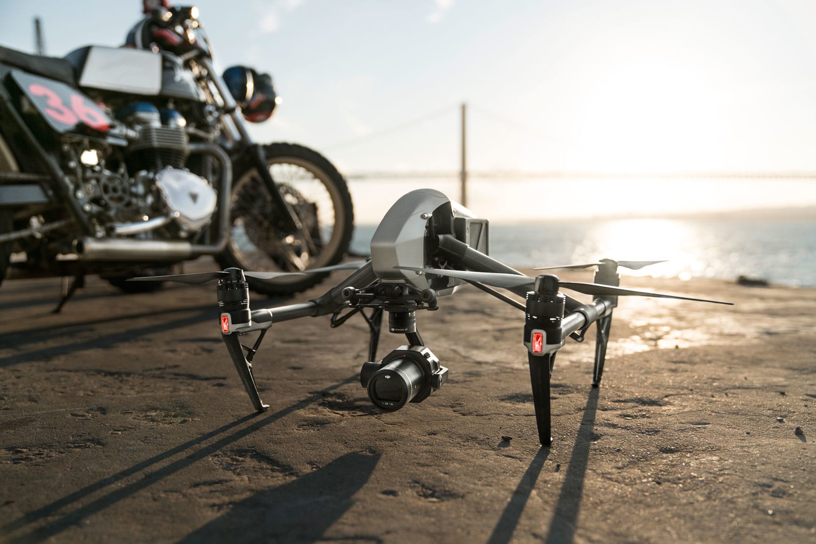 Drone on a beach next to a bike