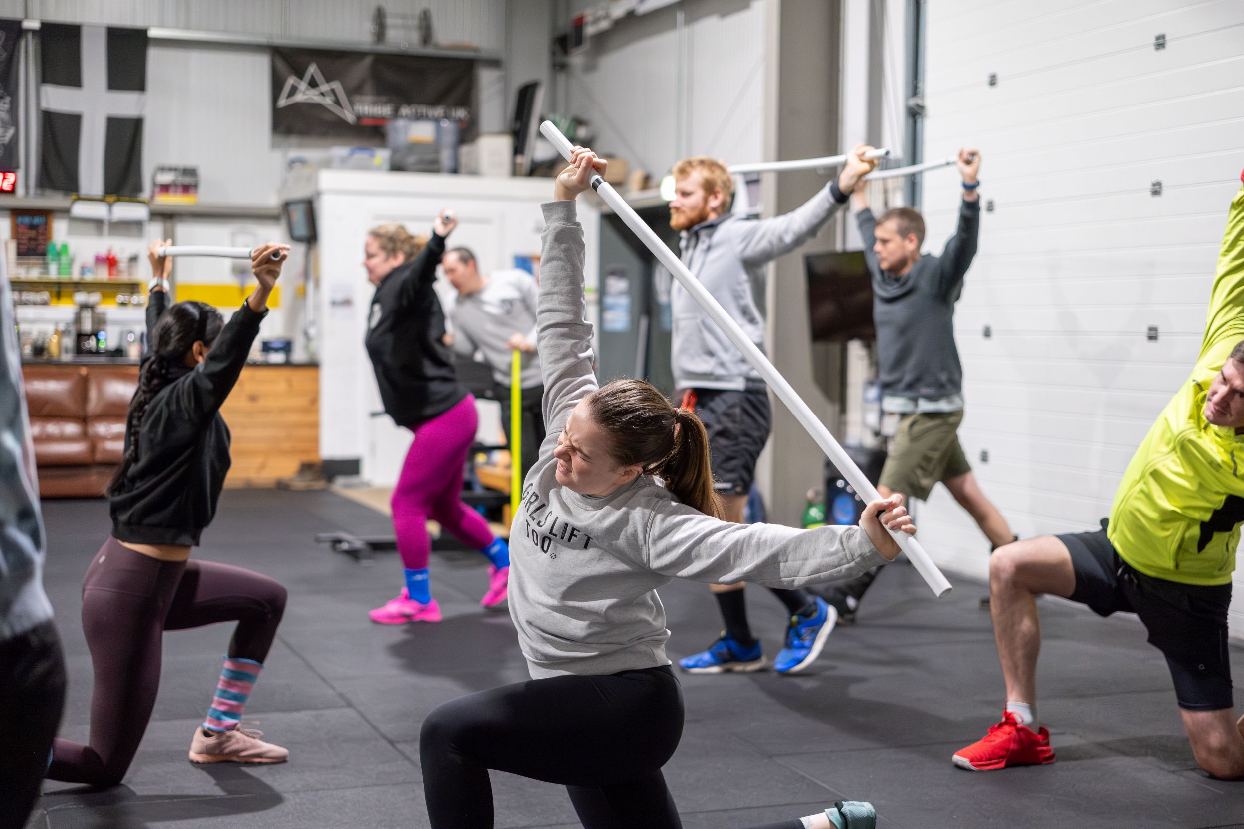 A group of people in a class stretching