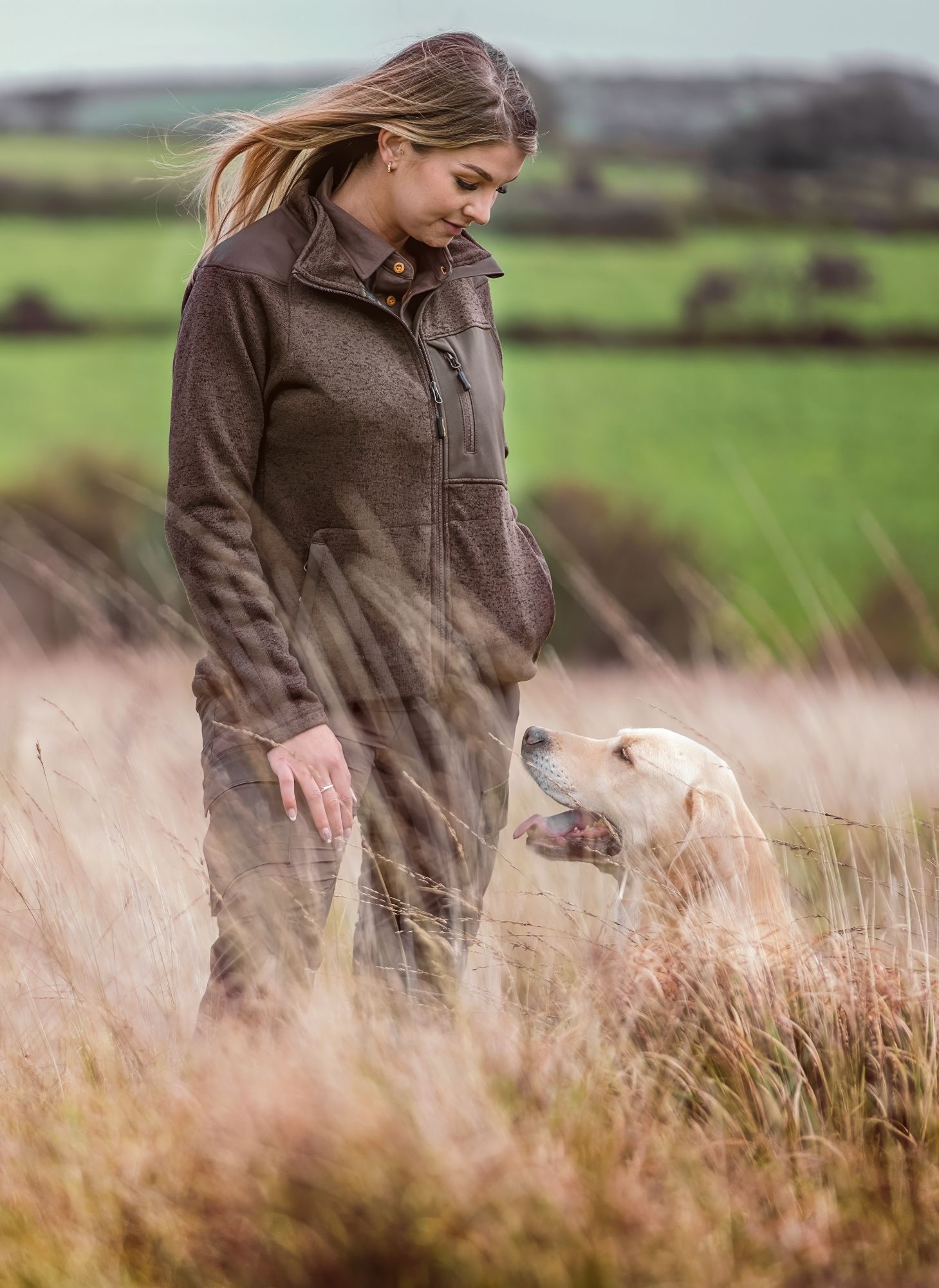 Woman in a field with her dog